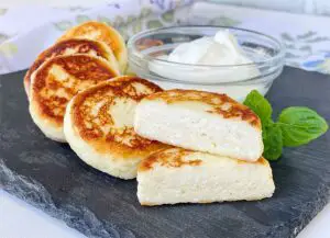 Cheese pancakes on the plate showing inside texture