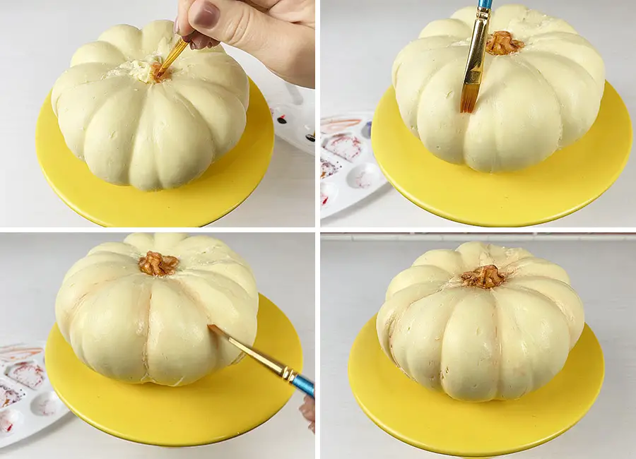 Coloring the the stalk of the pumpkin and in between each segment of the pumpkin