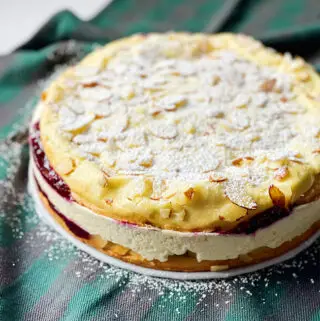 Polish Cake with Creamy Custard Filling and Berry Sauce
