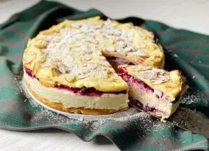 Polish Cake with Creamy Custard Filling and Berry Sauce