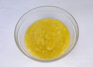 Placing the lemon filling into a bowl to cool down