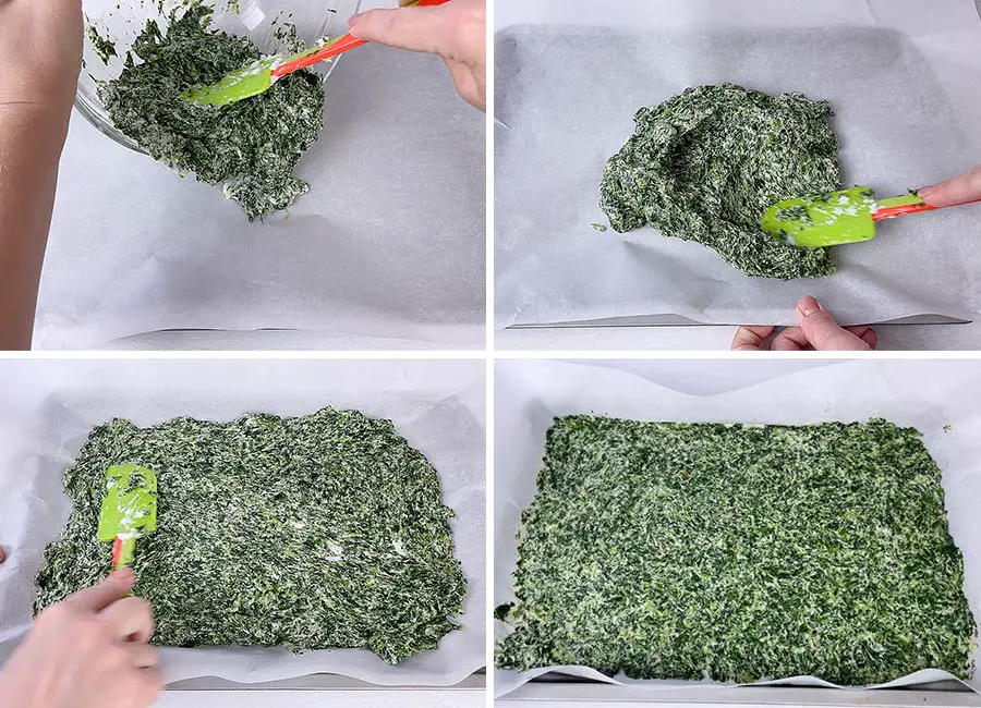 Spreading the spinach batter on the baking sheet.